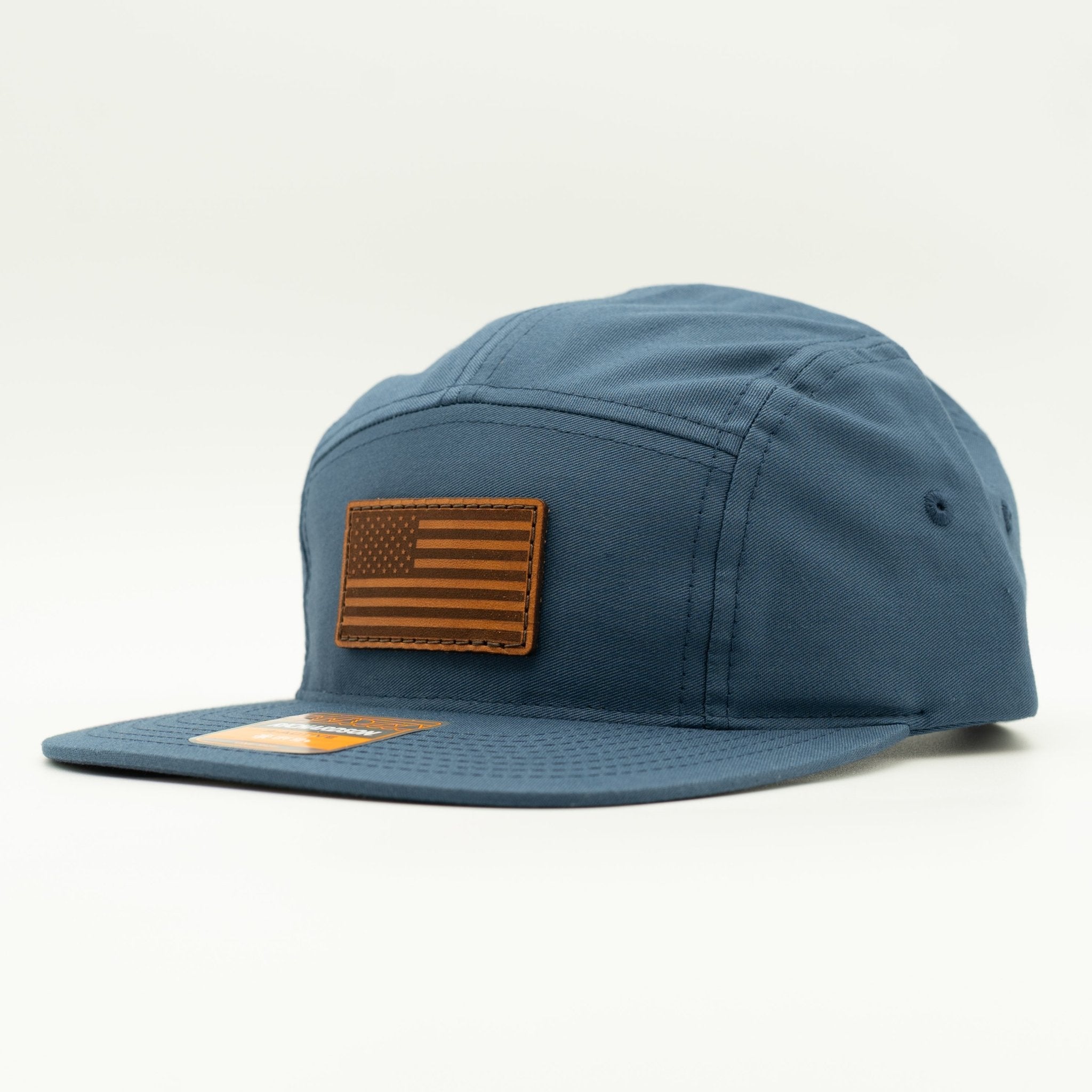 Blue cap with American flag patch on a white background

Color: Light Navy