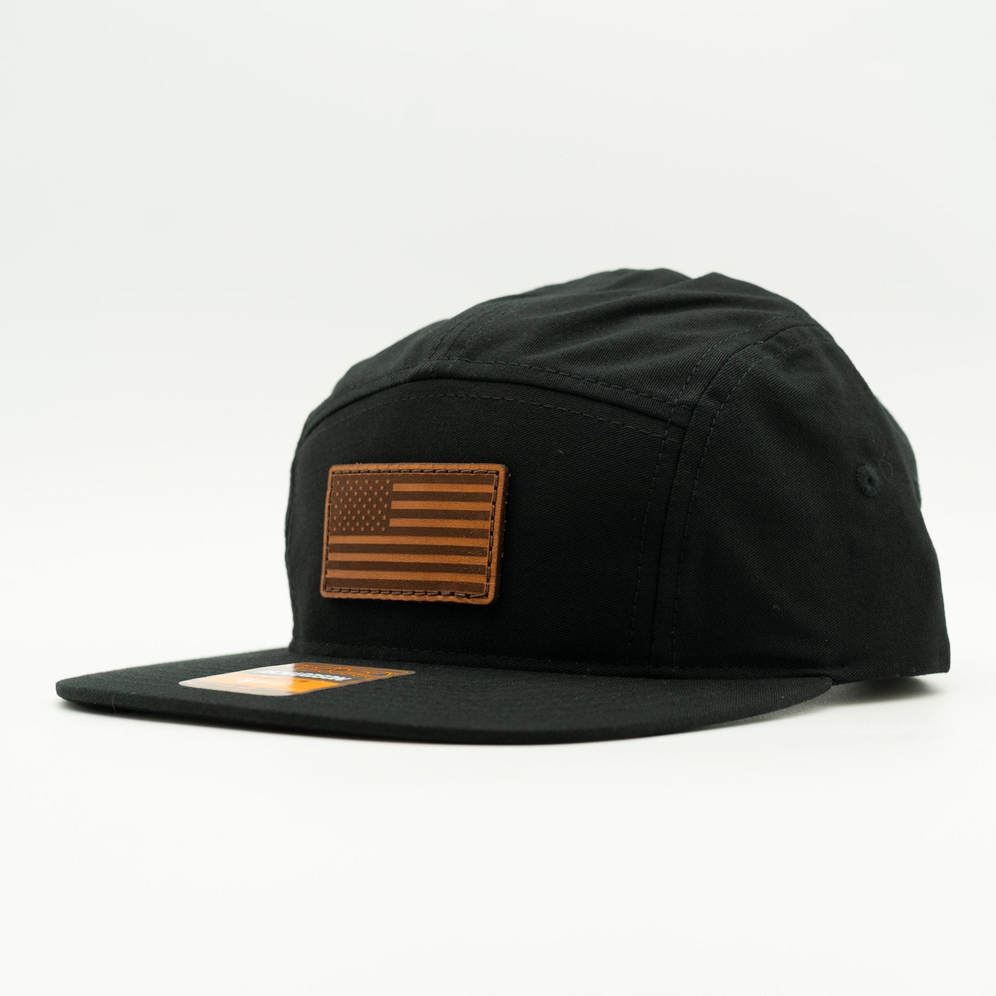 Black cap with a brown flag patch on a white background

Color: Black