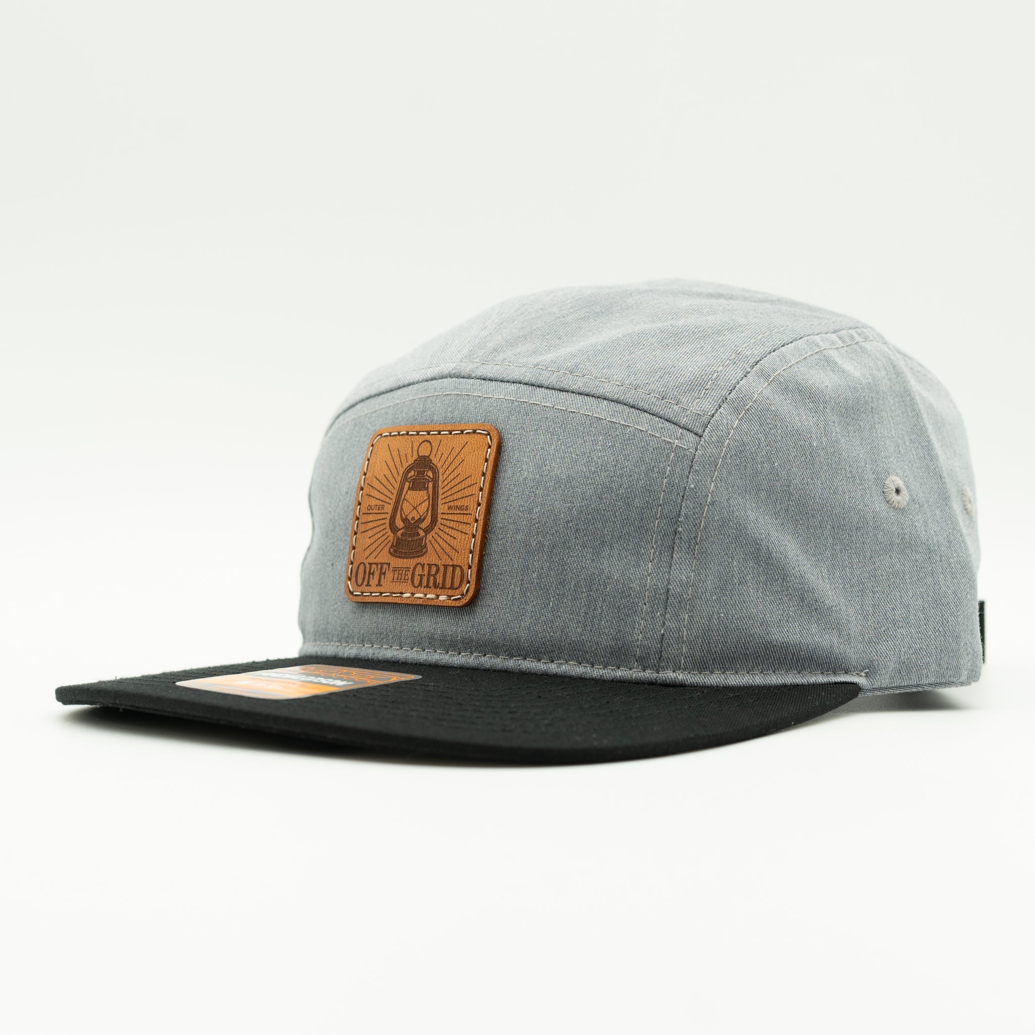 Heather grey and black Off The Grid camper hat side view, two tone Richardson 217 with sewn leather patch and flat bill.