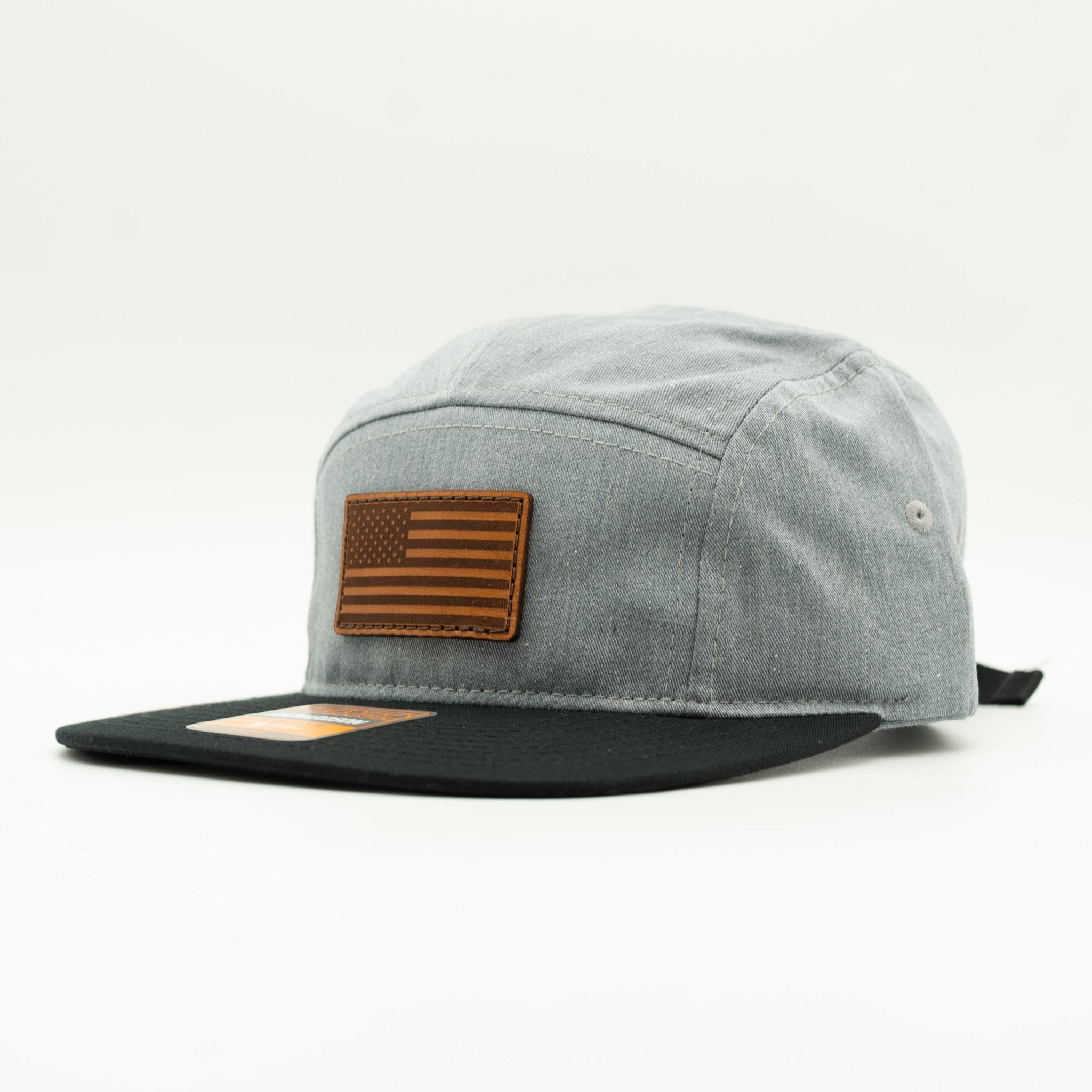 Gray cap with brown leather American flag patch on a white background

Color: Heather Grey/Black