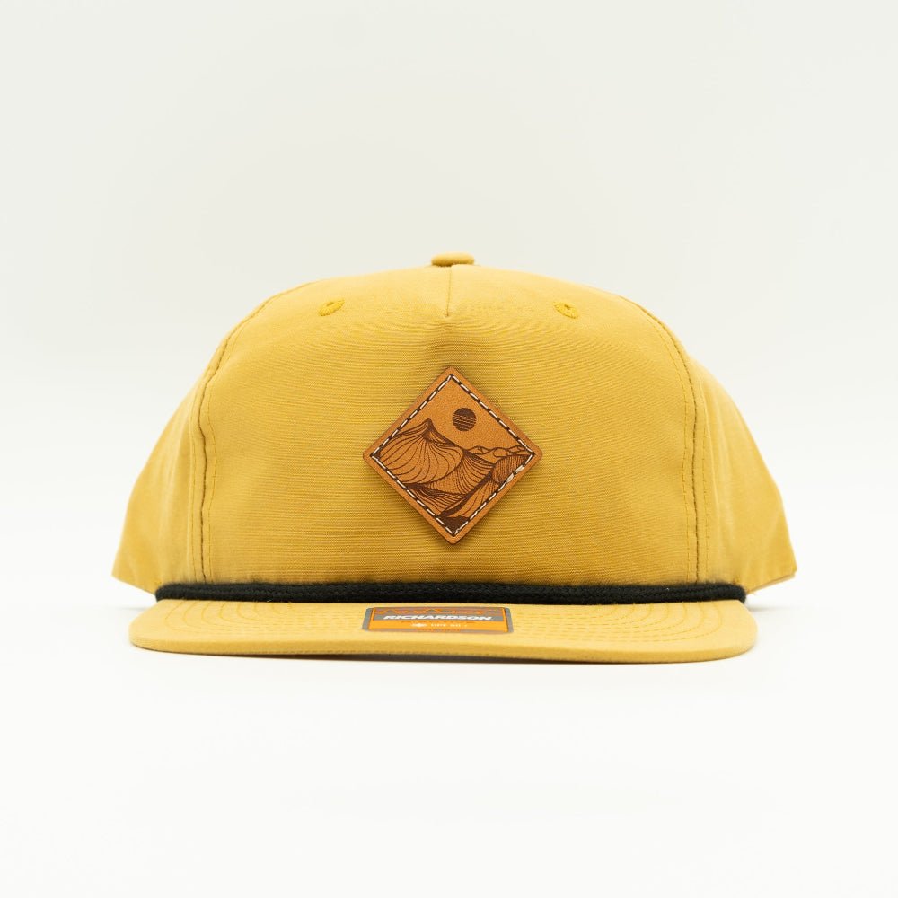 Biscuit/black Desert Mountain leather patch hat, Richardson 256 rope hat snapback, flat bill low profile 5 panel front view

Color: Biscuit
