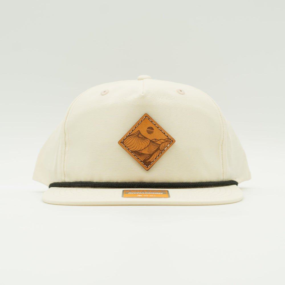 Front of birch Richardson 256 Desert Mountain rope hat featuring engraved leather Desert Mountain patch and classic flat bill.

Color: Birch