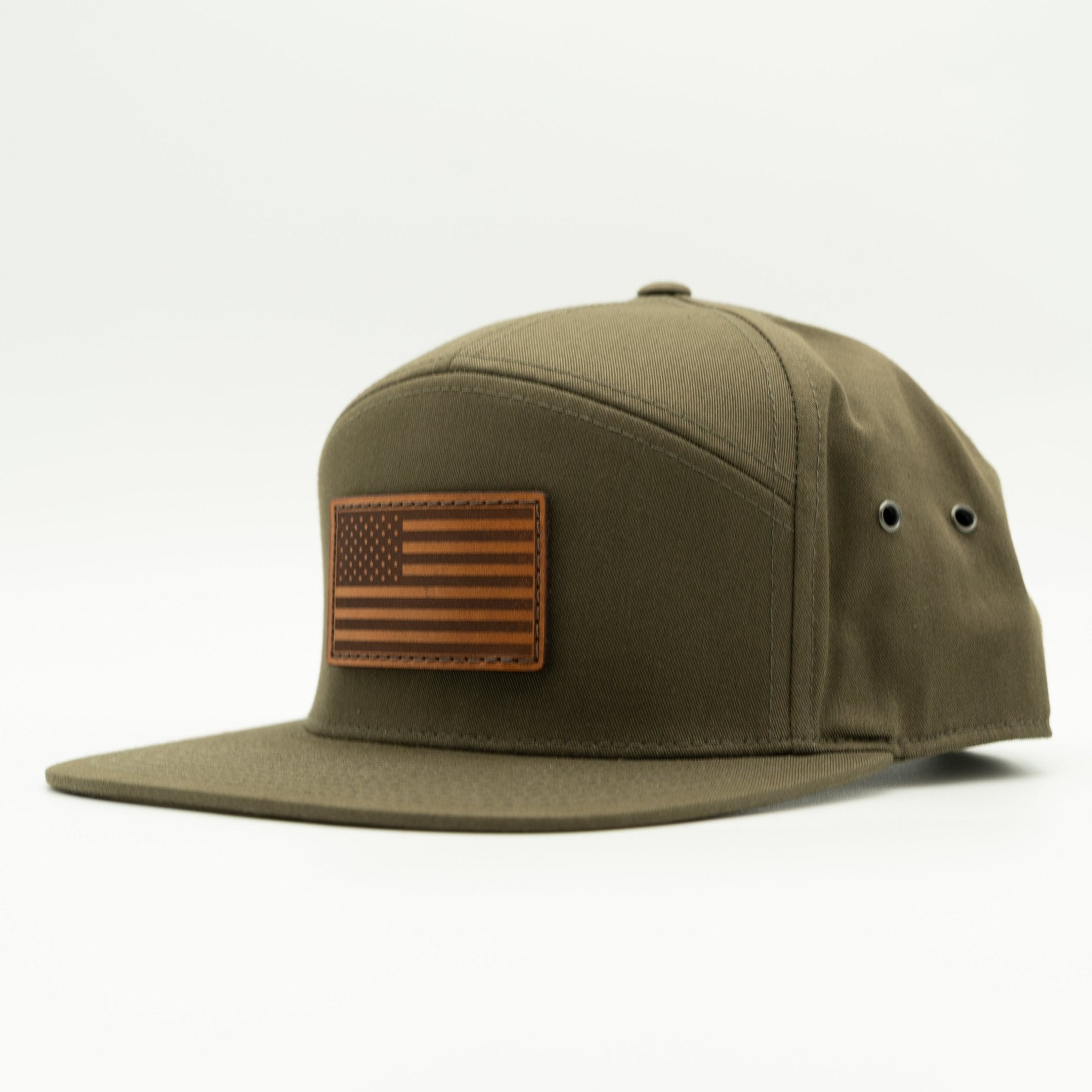 Olive green cap with American flag patch on a white background

Color: Olive