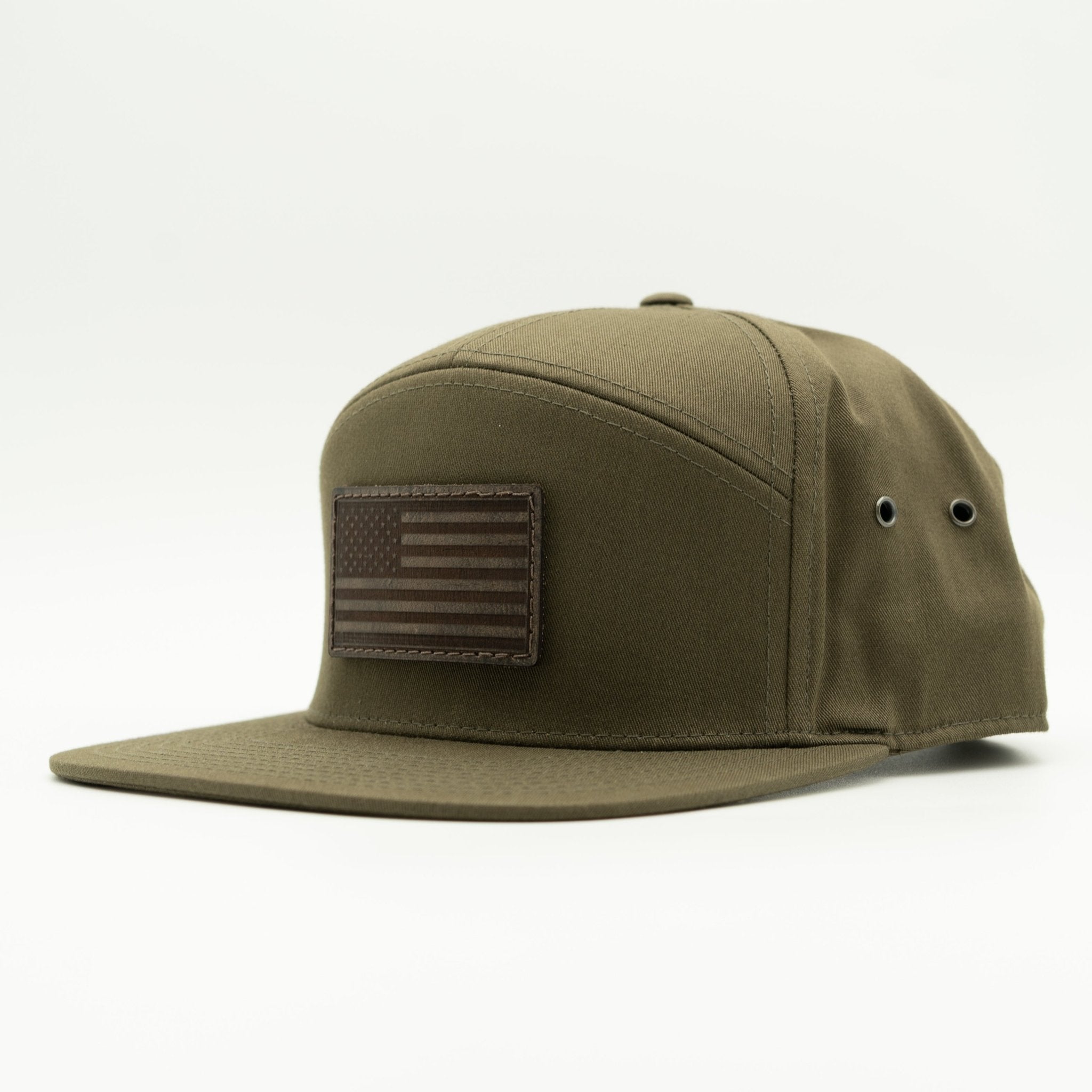 Olive green cap with American flag patch on a white background

Color: Olive