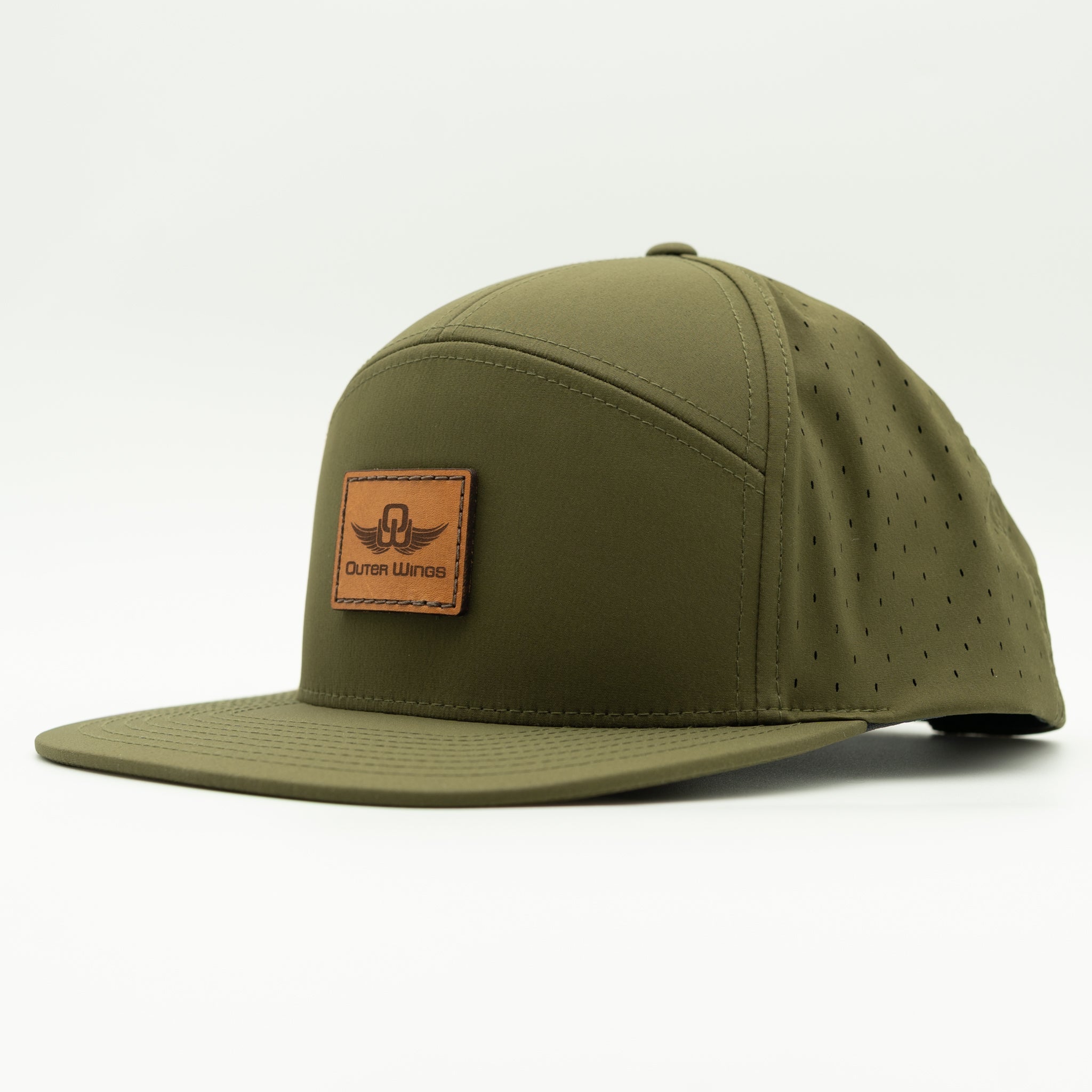An olive green 5-panel baseball cap with a flat brim, featuring a brown leather patch on the front with the 'Outer Wings' logo, set against a plain white background.

Color: Olive