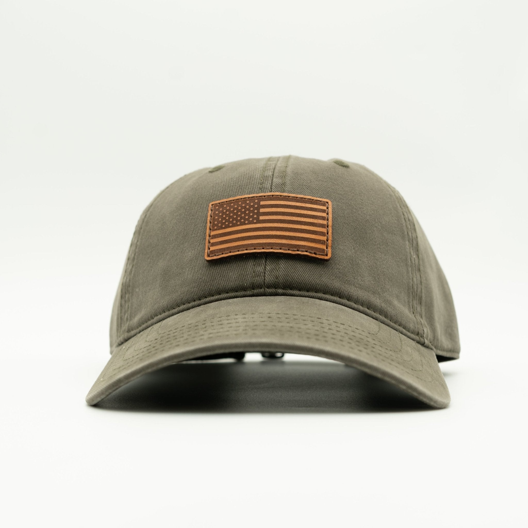 Green cap with American flag patch on a white background

Color: Olive
