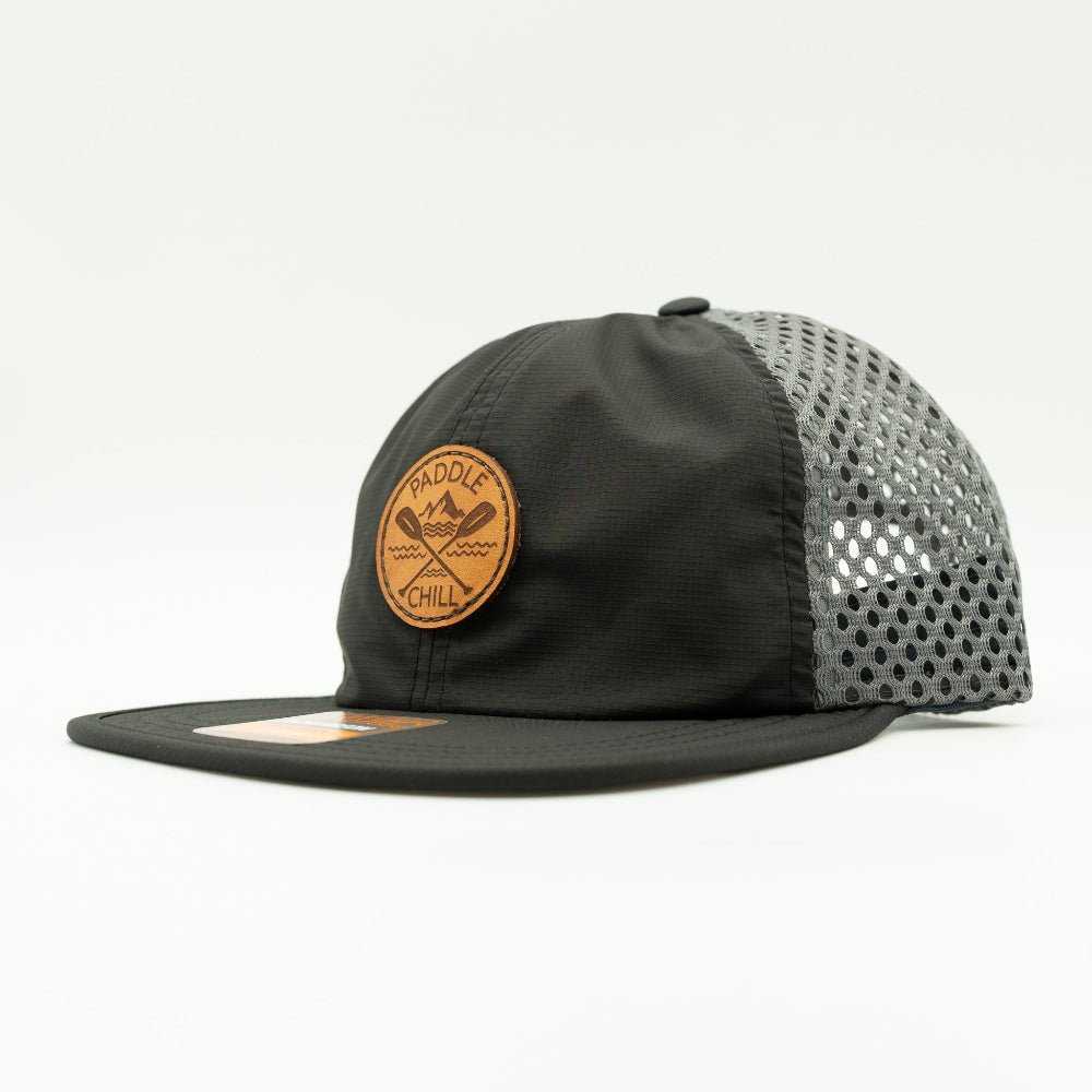 Side angle of black and charcoal Paddle and Chill leather patch hat, rugged water resistant Richardson 935 paddleboard and fishing hat.