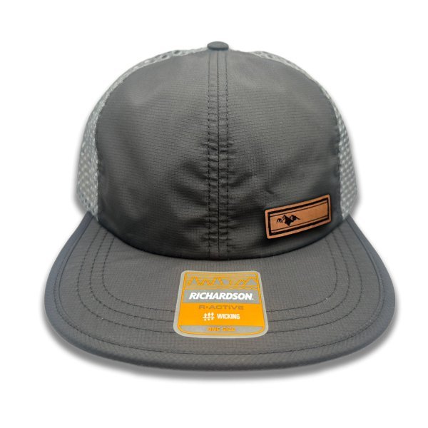 Front view of Richardson 935 hat in black/charcoal with Active Mountain leather patch, showcasing a clean mountain design on full-grain leather.