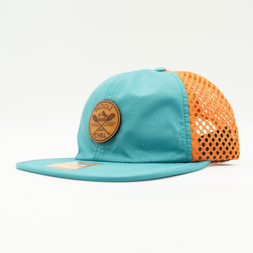 Side view of teal and orange Paddle and Chill leather patch hat, eye-catching water resistant Richardson 935 SUP and kayak hat.