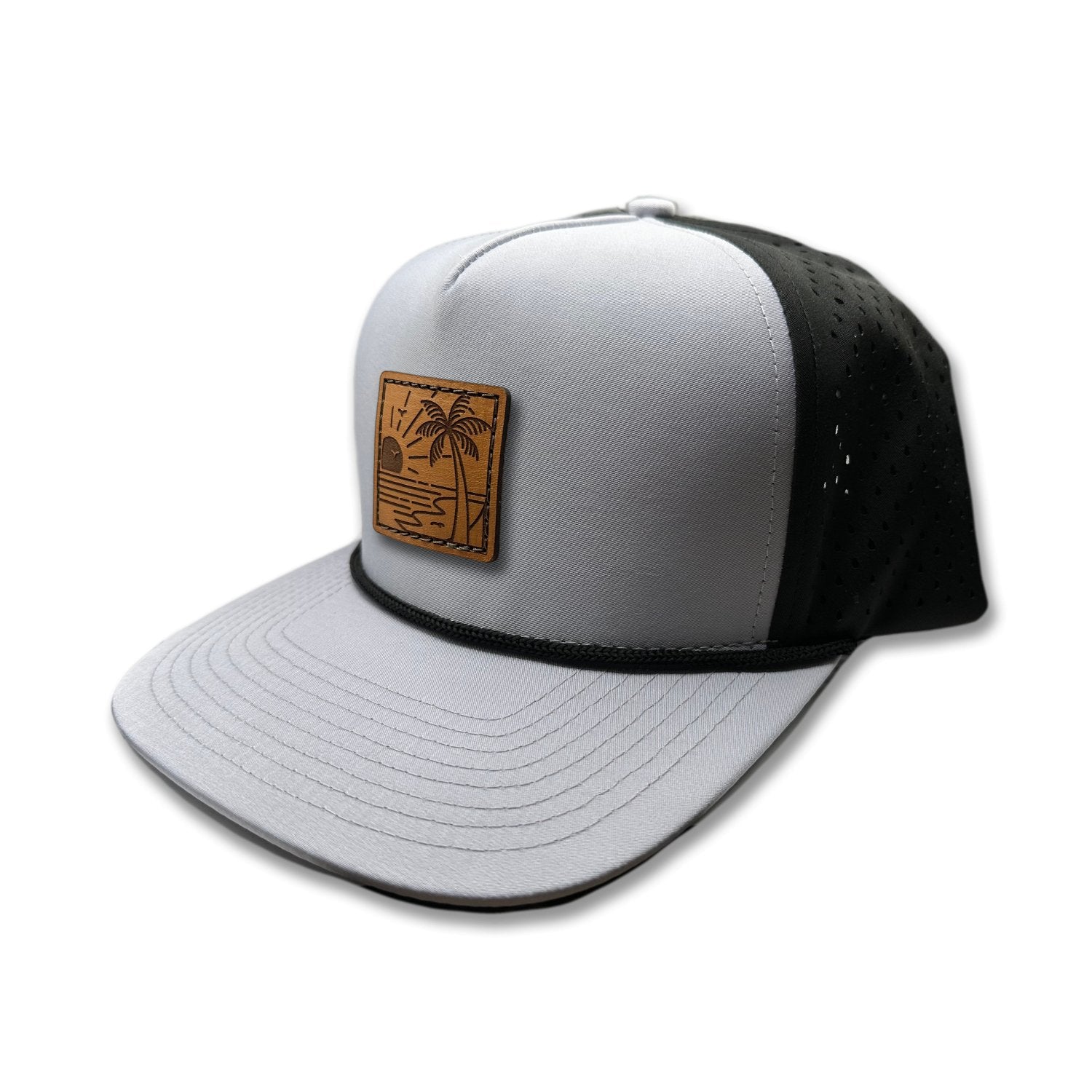 Side view of the Seaside Serenity Leather Patch Hat by Outer Wings in grey/black, highlighting the water-resistant nylon fabric, adjustable snapback, and rope detail. A versatile custom leather patch hat for both outdoor adventures and casual wear.