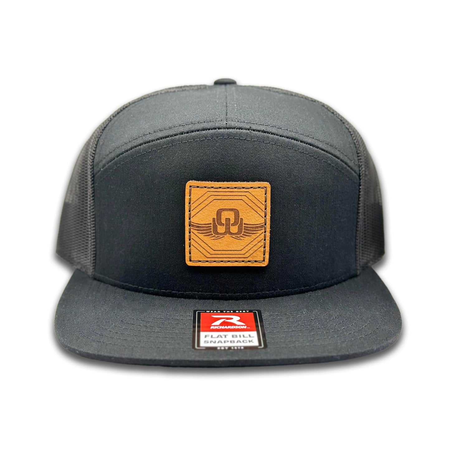 Front view of the Skybound Leather Patch Hat by Outer Wings in Black, featuring a high-profile, seven-panel Richardson 168 trucker hat with a laser-engraved leather patch of the Skybound design. Perfect for outdoor enthusiasts and nature lovers