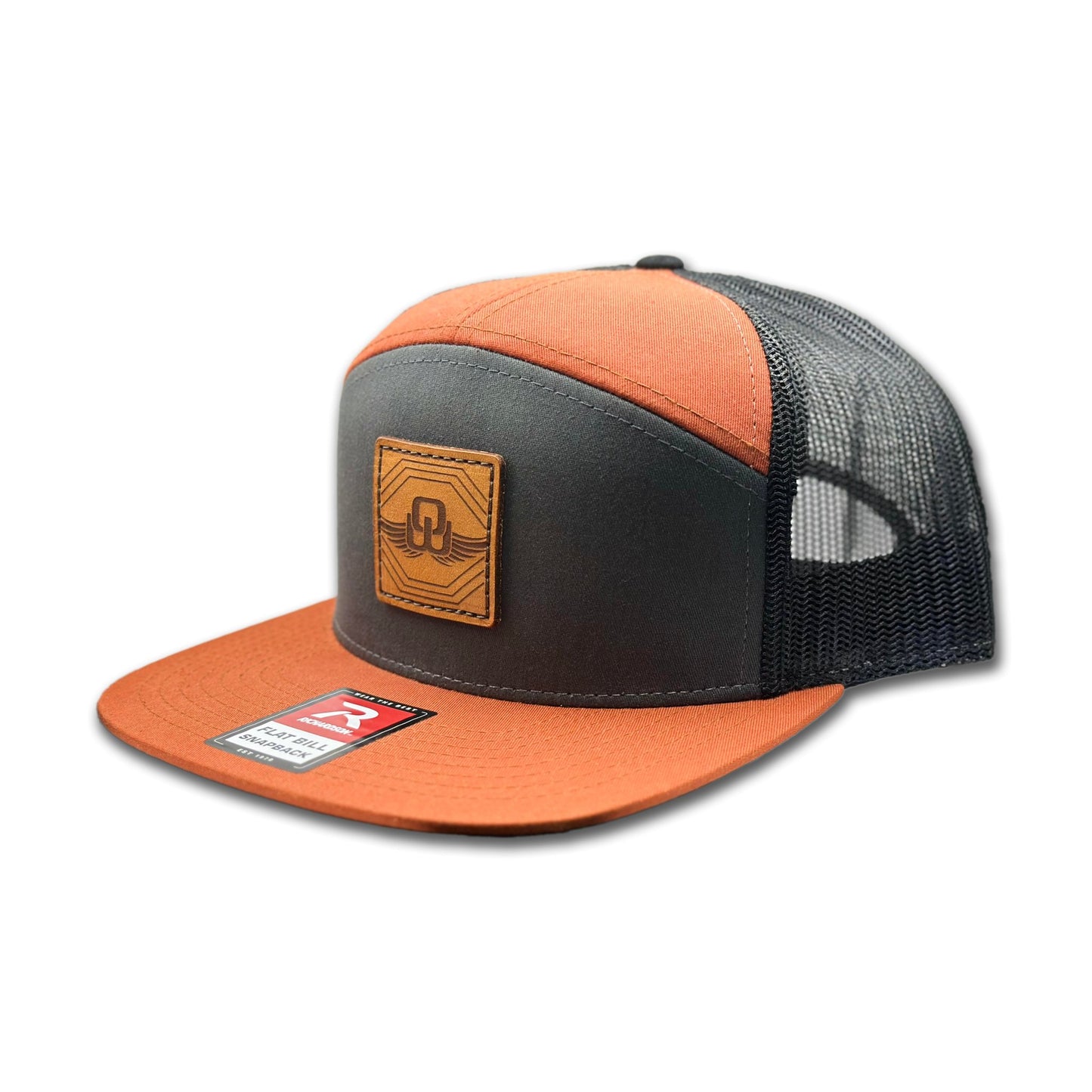 Side view of the Skybound Leather Patch Hat by Outer Wings in Charcoal/Burnt Orange/Black, highlighting the flat bill, adjustable SnapBack closure, and mesh back for breathability. A rugged, stylish performance hat for all outdoor activities.