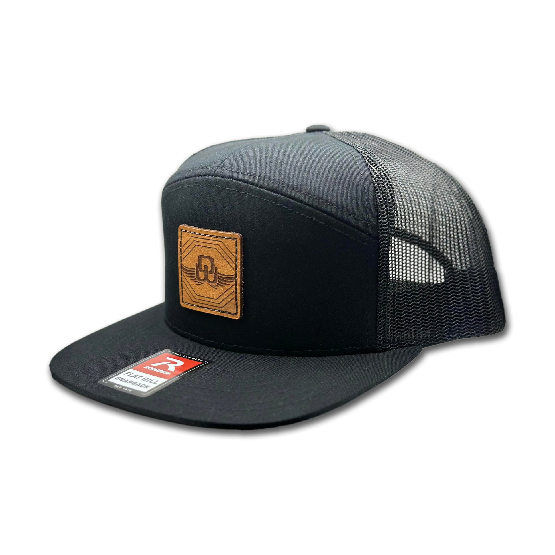 Side view of the Skybound Leather Patch Hat by Outer Wings in Black, highlighting the flat bill, breathable mesh back, and adjustable SnapBack closure. A rugged and stylish custom leather patch hat for all outdoor adventures.