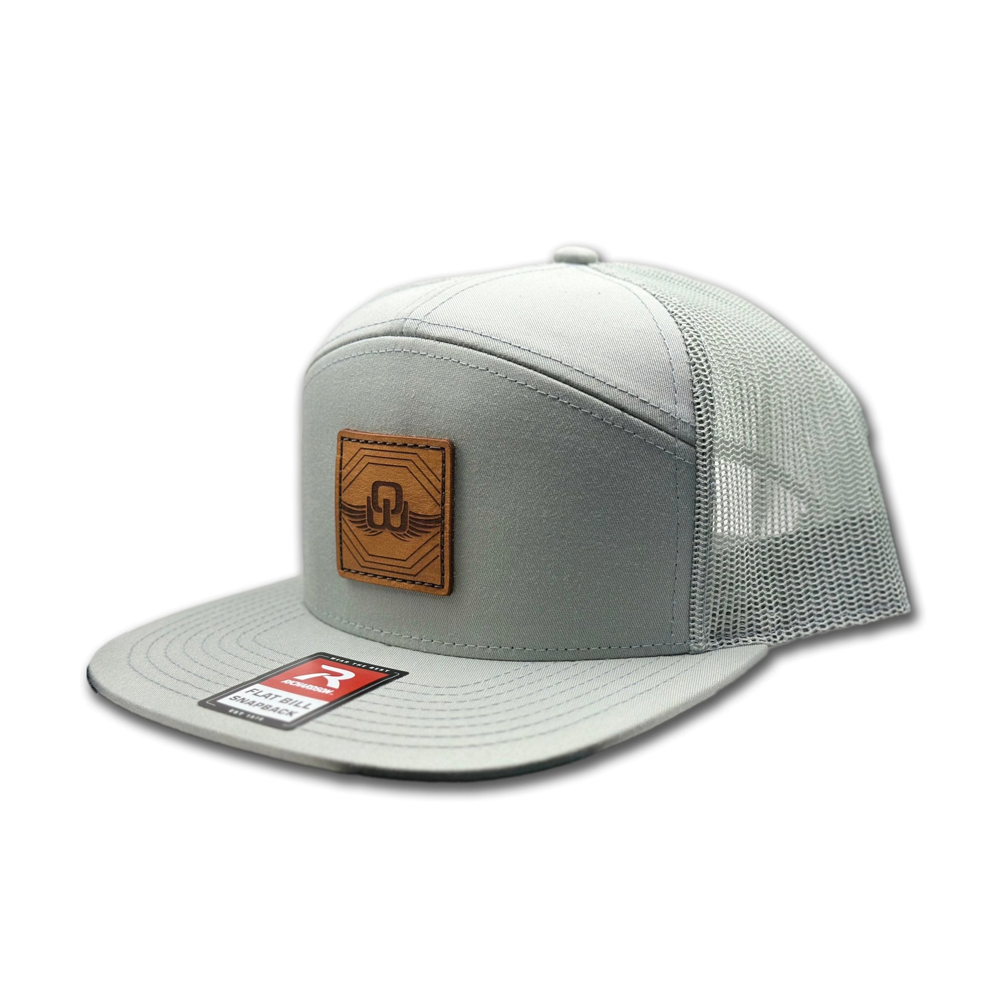 Side view of the Skybound Leather Patch Hat by Outer Wings in Quarry, showing the breathable mesh back, flat bill, and adjustable SnapBack closure. A versatile and durable custom leather patch hat for all your outdoor adventures.