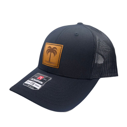 Side view of the Solo Palm Leather Patch Hat by Outer Wings in Black/Black, highlighting the breathable mesh back, structured profile, and adjustable SnapBack closure. A durable and stylish custom leather patch hat for outdoor and casual wear.