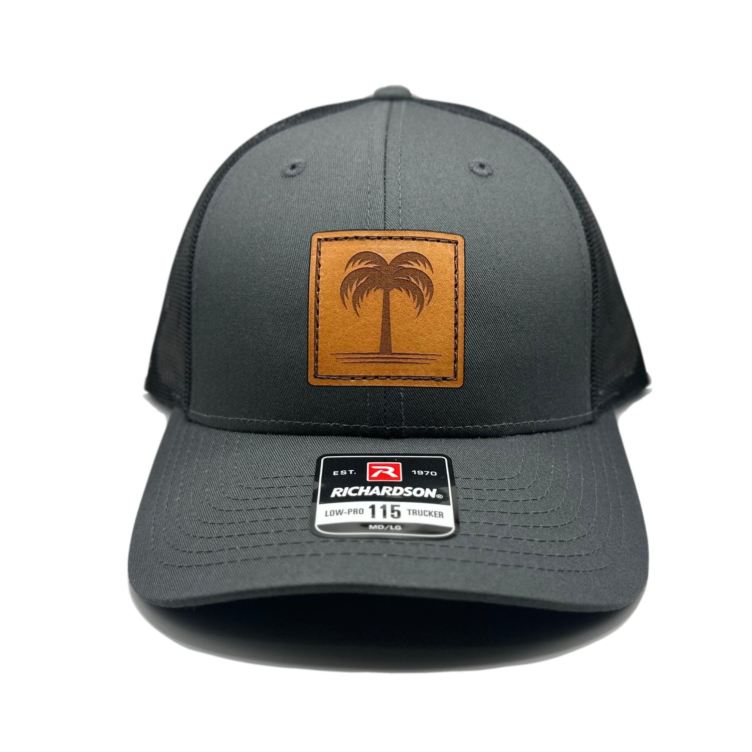 Front view of the Solo Palm Leather Patch Hat by Outer Wings in Charcoal/Black, crafted on a low-profile Richardson 115 with a laser-engraved leather patch featuring a single palm tree design. Available in M/L size, perfect for outdoor adventures.