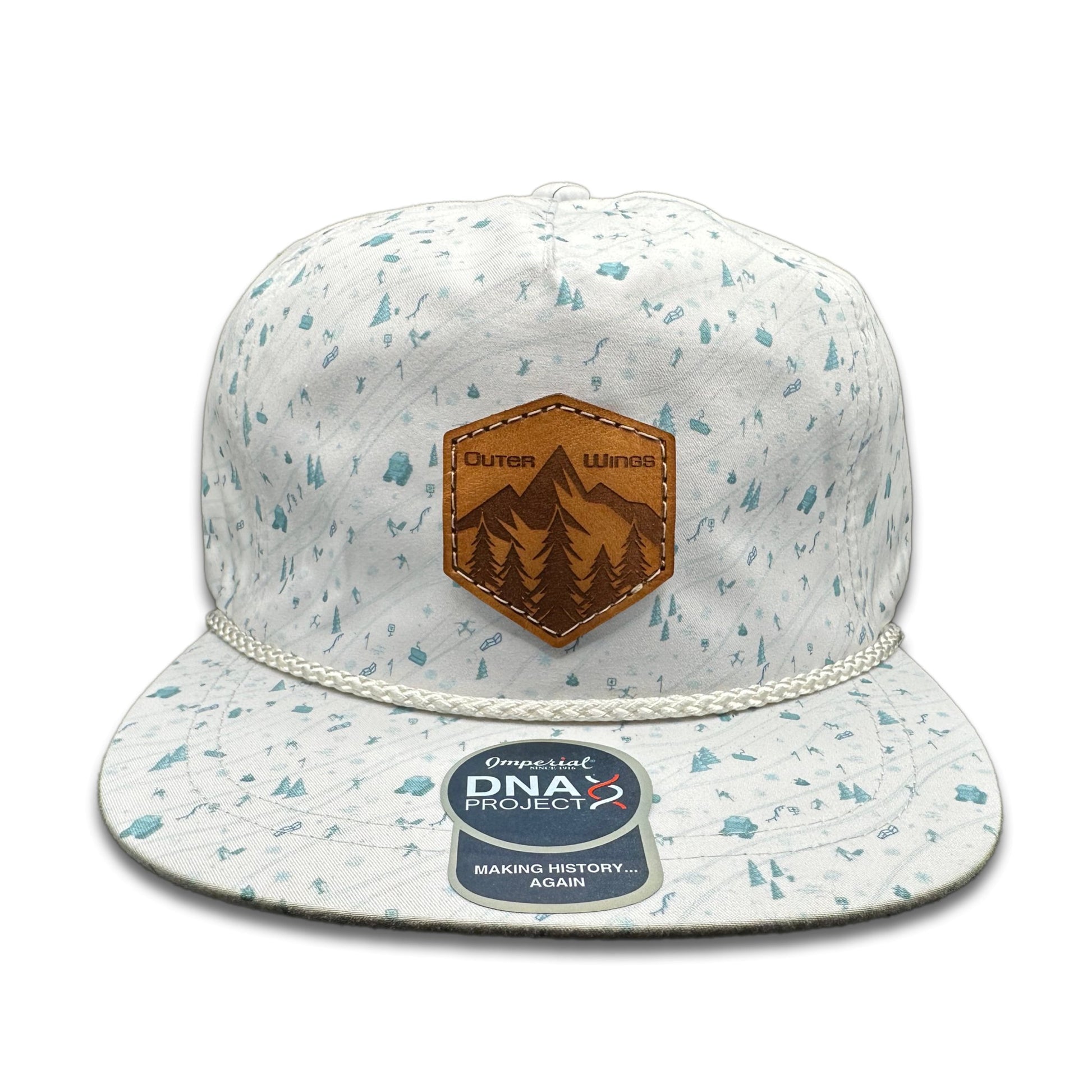 Front view of the Summit Seeker Leather Patch Hat by Outer Wings in Blue Mountain, featuring a mid-profile, structured Imperial DNA010 Aloha Rope Hat with a leather patch of mountains and pine trees. Ideal for hiking and casual wear.