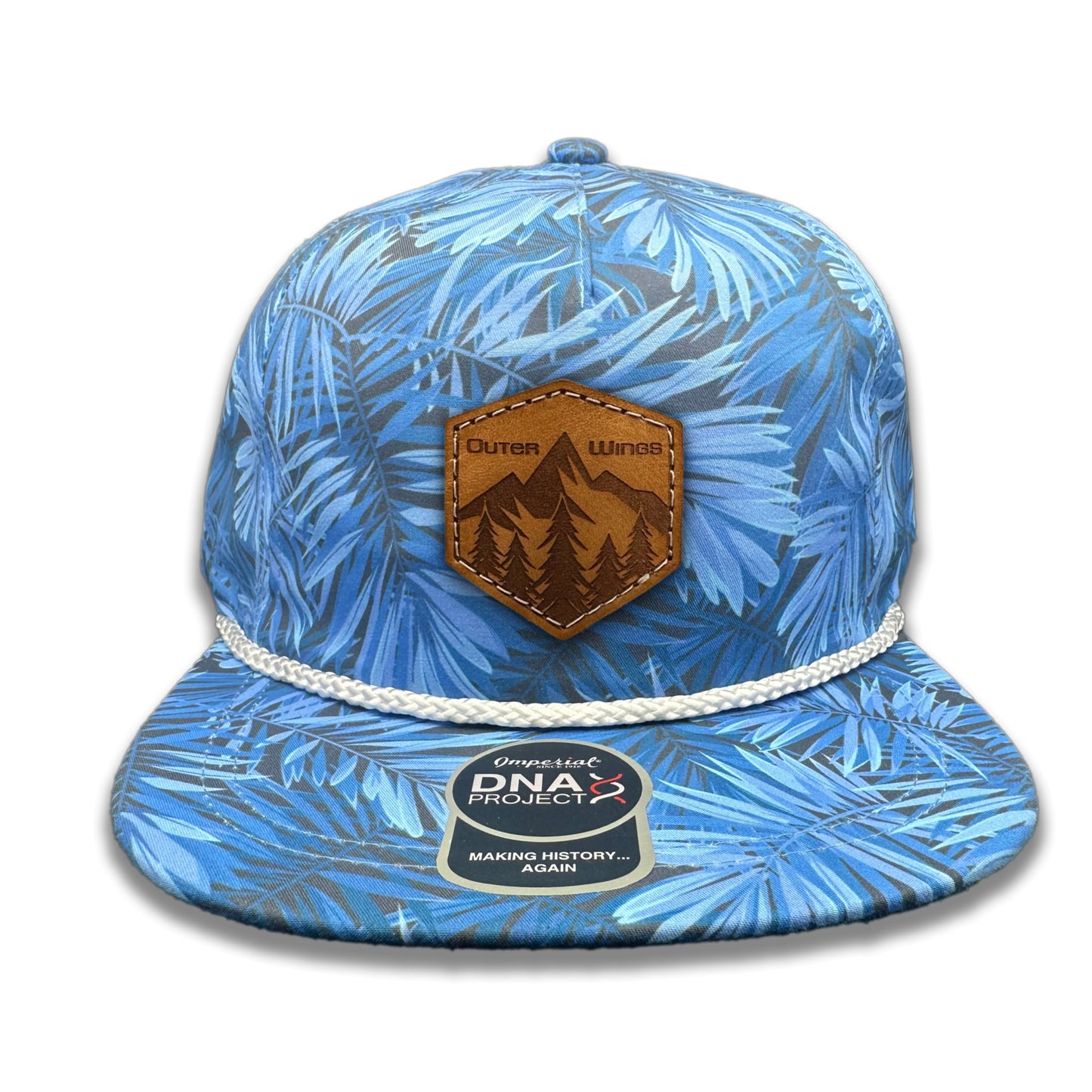 Front view of the Summit Seeker Leather Patch Hat by Outer Wings in Blue Hawaiian, featuring a mid-profile, five-panel Imperial DNA010 Aloha Rope Hat with a leather patch showcasing mountains, pine trees, and the Outer Wings logo. Perfect for outdoor adventures.