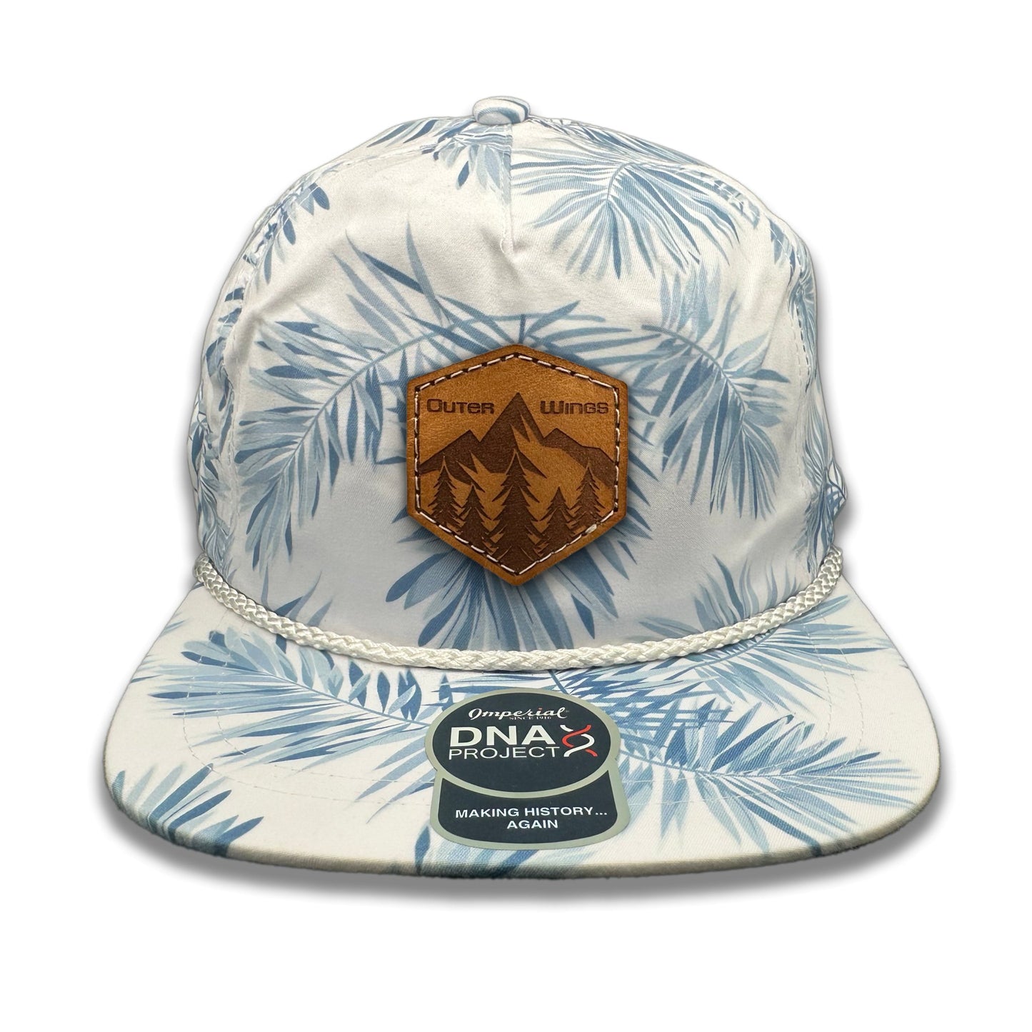 Front view of the Summit Seeker Leather Patch Hat by Outer Wings in White Pine, crafted on a mid-profile, five-panel Imperial DNA010 with a laser-engraved leather patch featuring a mountain and pine tree design. Perfect for outdoor enthusiasts.