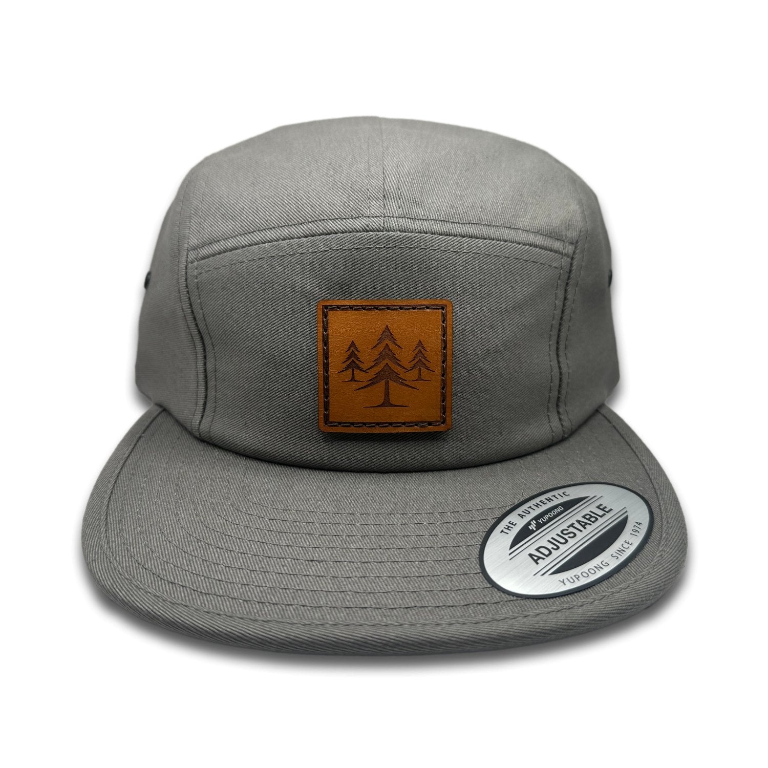 Front view of the Three Lil Pines Leather Patch Hat by Outer Wings in Dark Grey, featuring a low profile Yupoong 7005 hat with a laser-engraved leather patch showcasing three pine trees. Ideal for hiking and outdoor adventures.