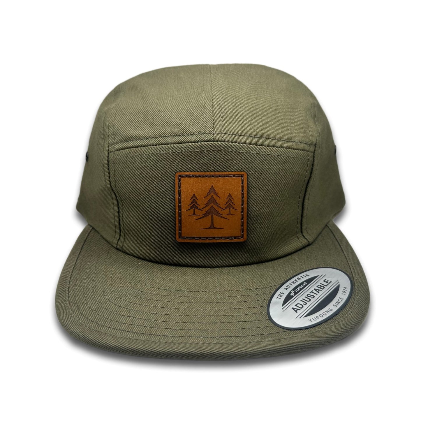 Front view of the Three Lil Pines Leather Patch Hat by Outer Wings in Olive, featuring a low profile, five-panel Yupoong 7005 jockey flat bill hat with a genuine leather patch of three pine trees. Perfect for outdoor enthusiasts and casual wear.