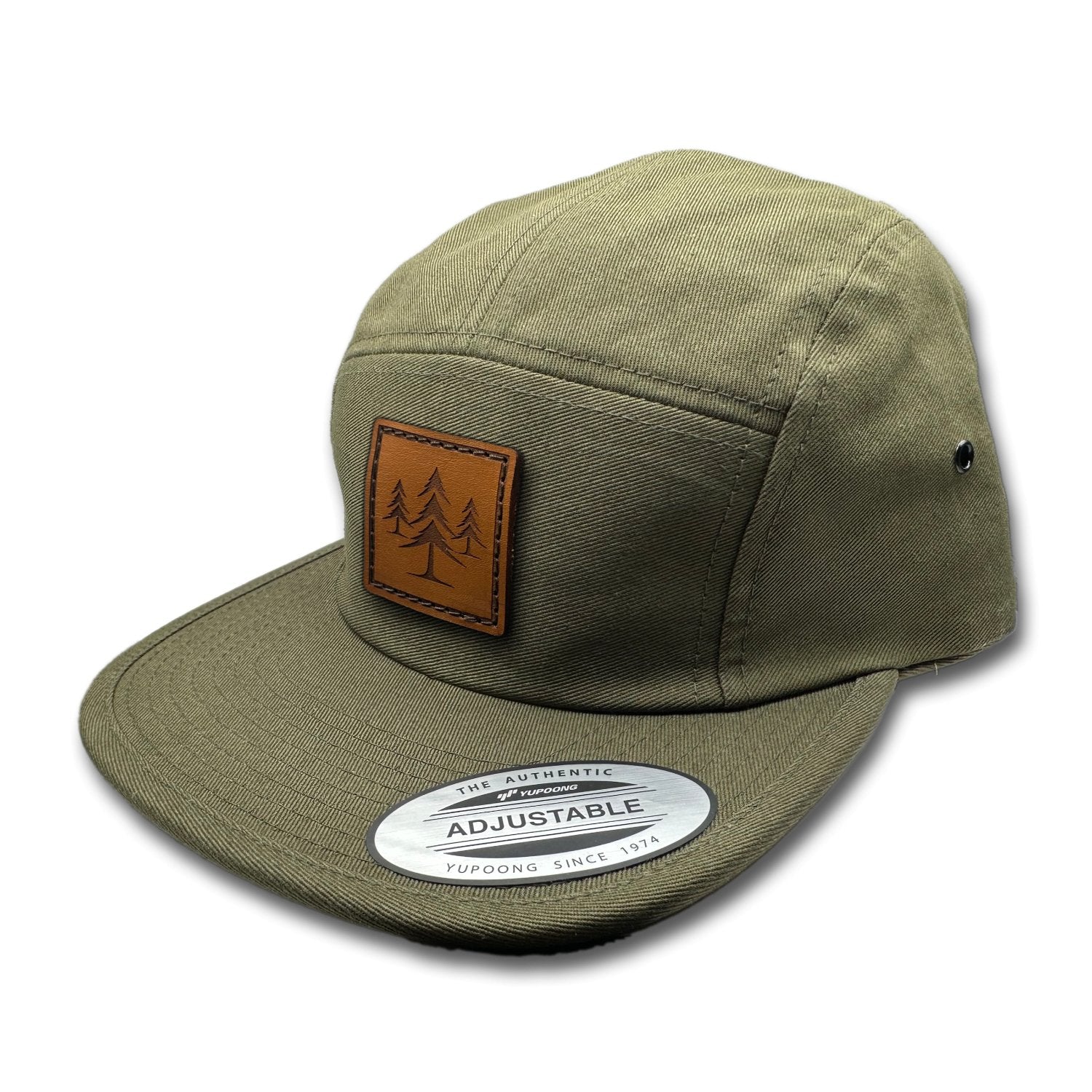 Side view of the Three Lil Pines Leather Patch Hat by Outer Wings in Olive, highlighting the soft-structured design, flat bill, and adjustable nylon strap closure. A stylish custom leather patch hat for hiking and everyday wear