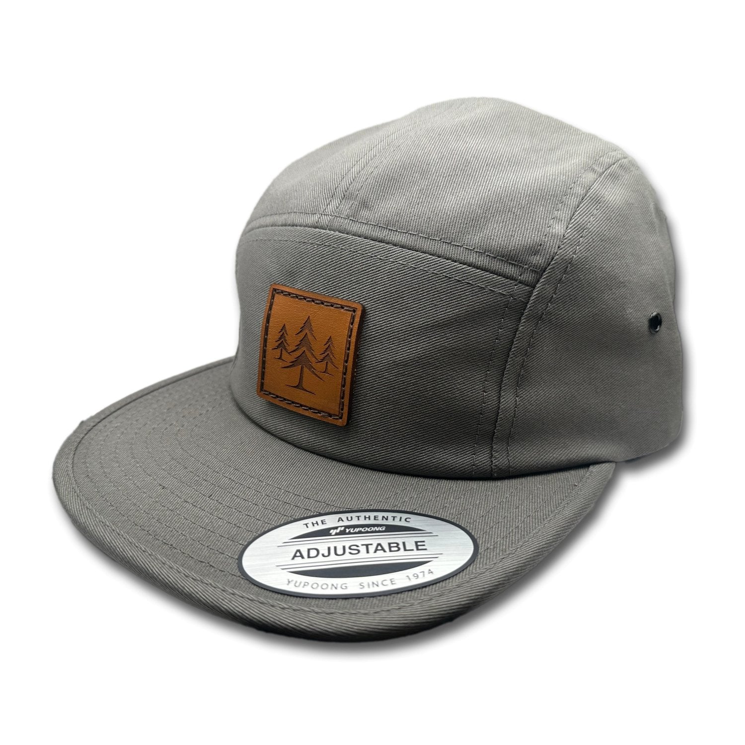 Side view of the Three Lil Pines Leather Patch Hat by Outer Wings in Dark Grey, highlighting the flat bill, soft-structured profile, and adjustable strap closure. A rugged outdoors hat for all your adventures.