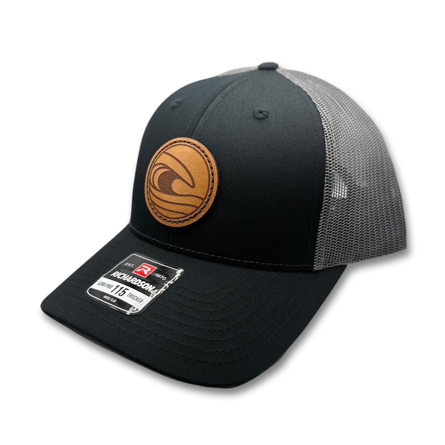 Side view of the Tidal Wave Leather Patch Hat by Outer Wings in Black/Charcoal, showcasing the breathable mesh back, structured profile, and adjustable SnapBack closure. A rugged outdoors hat for all your adventures.