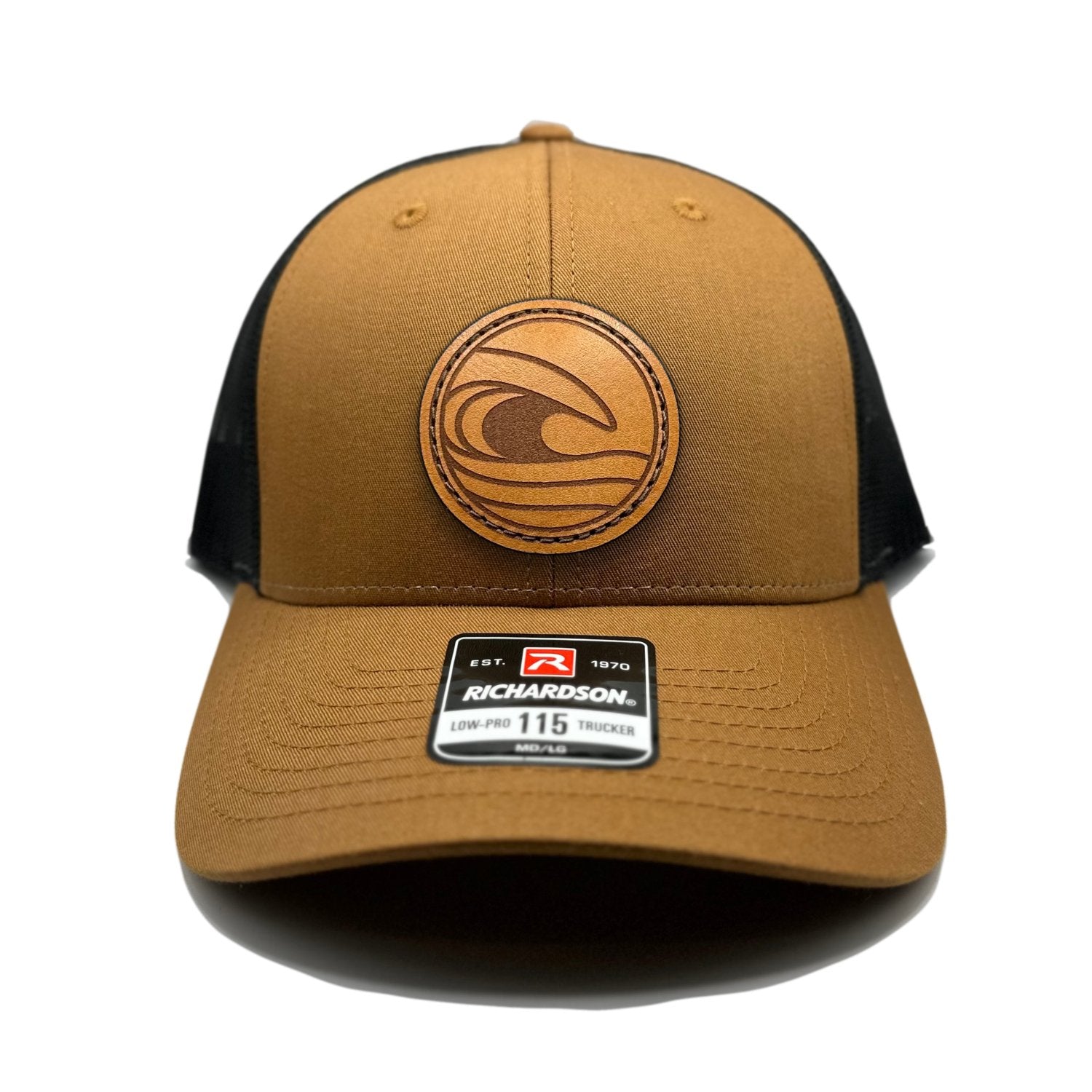 Front view of the Tidal Wave Leather Patch Hat by Outer Wings in Caramel/Black, featuring a low profile, structured Richardson 115 hat with a leather patch of an ocean wave design. Available in M/L size.