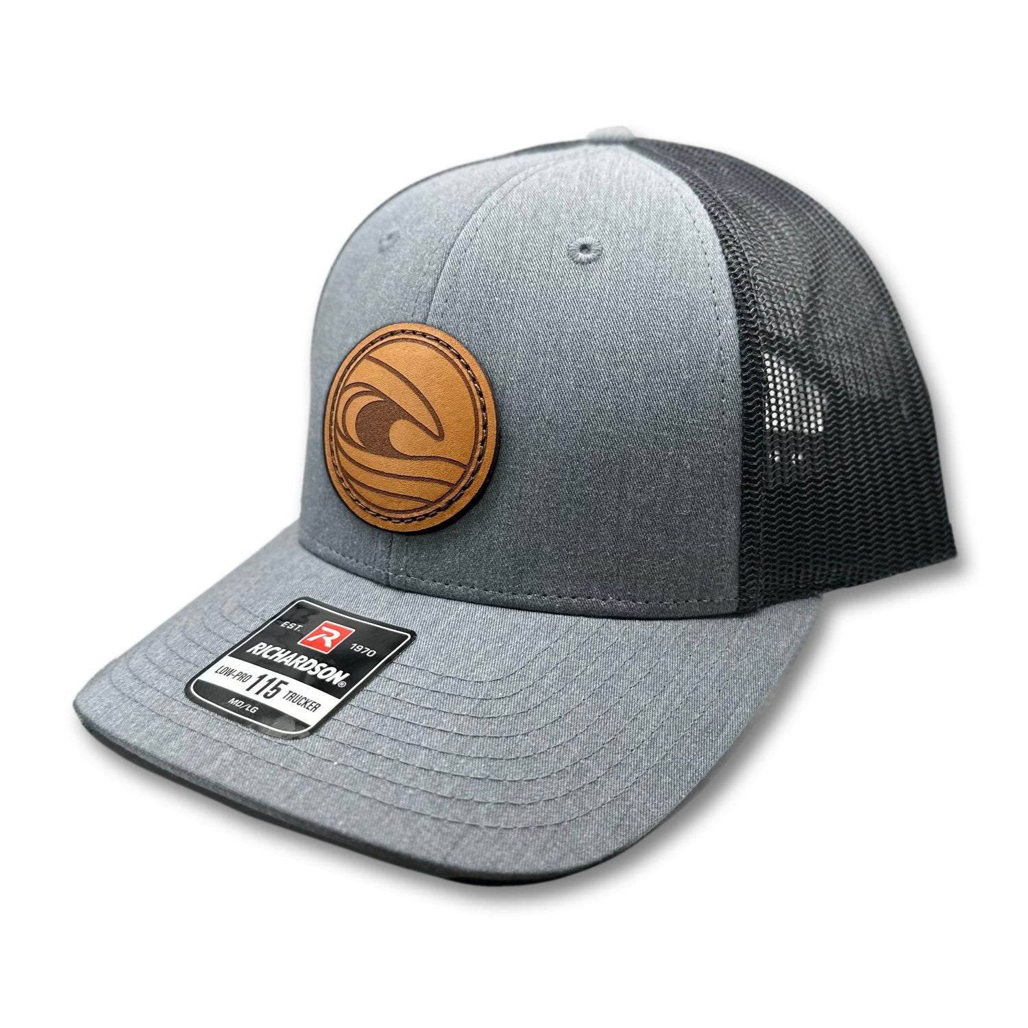 Side view of the Tidal Wave Leather Patch Hat by Outer Wings in Heather Grey/Charcoal, highlighting the structured design, mesh back, and adjustable SnapBack closure. A rugged yet stylish outdoors hat for all your adventures.