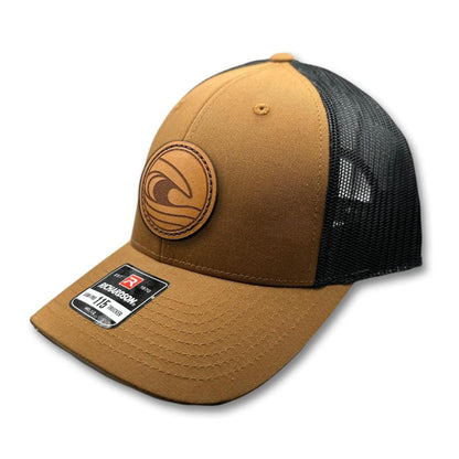 Side view of the Tidal Wave Leather Patch Hat by Outer Wings in Caramel/Black, showcasing the structured fit, breathable mesh back, and adjustable SnapBack closure. A versatile outdoors hat for outdoor enthusiasts.