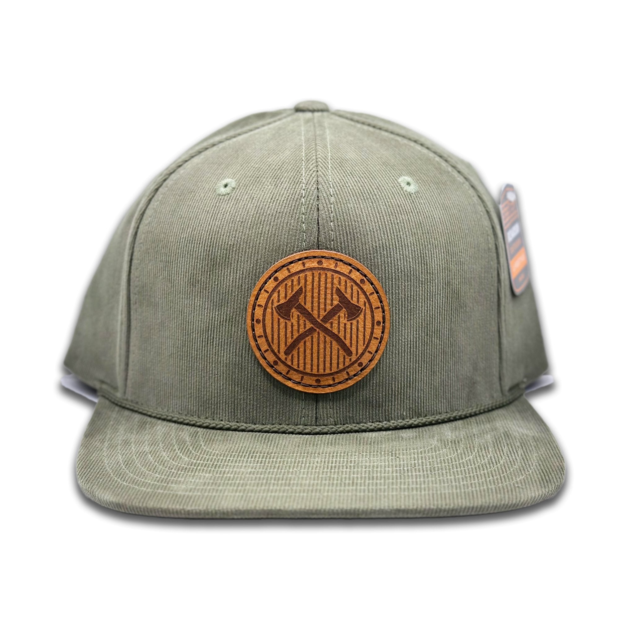 Front view of the Trailblazer Leather Patch Hat by Outer Wings in Olive, featuring a high-profile Richardson 253 with a leather patch showcasing crossed axes. Ideal for those seeking a flat bill hat with outdoor style.