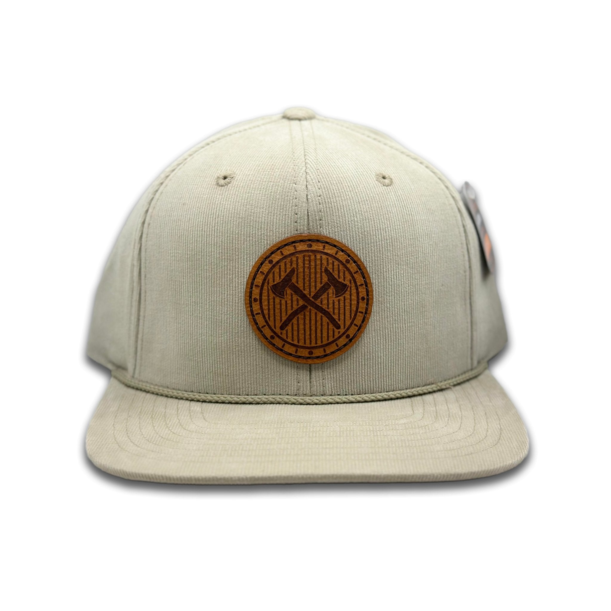 Front view of the Trailblazer Leather Patch Hat by Outer Wings in Tan, featuring a high-profile, structured Richardson 253 corduroy hat with a hand-sewn leather patch of crossed axes. Perfect for outdoor enthusiasts and casual wear.