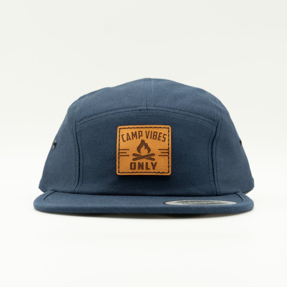 Front view of navy Yupoong 7005 Camp Vibes Only hat with round campfire leather patch centered on the crown.

Color: Navy